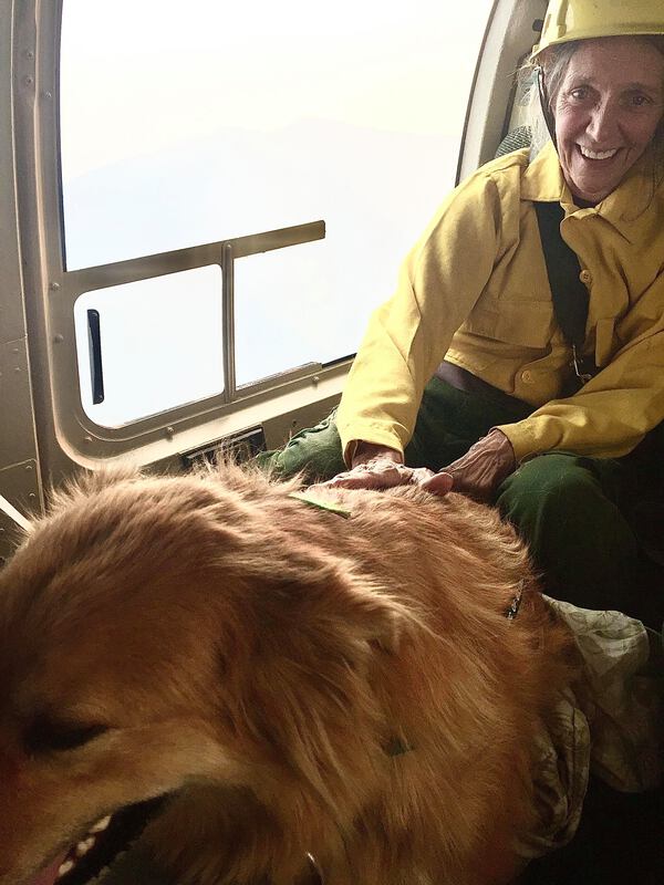 Photo of Rhett Moak and her dog being evacuated during the Eagle Creek Fire