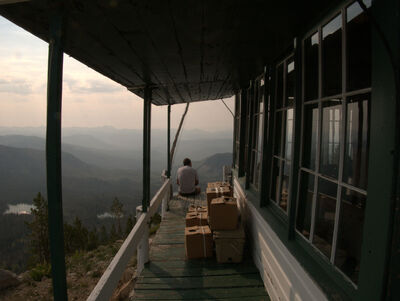 Andy Baca sitting on the catwalk of Ruffneck Lookout