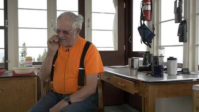 Bill Moore gives the Keeping Watch team a demo on the Osborne Fire Finder while locked in by smoke from the 2021 Lolo Complex Fires.