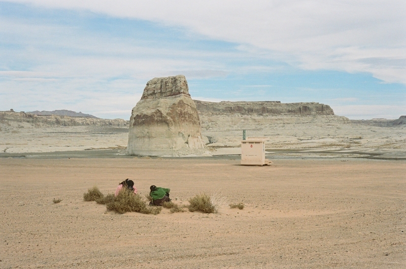 Tourists examining the sediment beds at Lone Rock