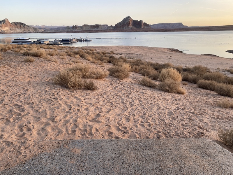 Pathway to boat dock empties into Lake Powell's dry bed