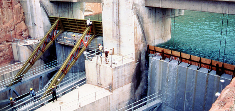 Engineers nail plywood to the top of Glen Canyon Dam's spillways to prevent the lake from overtopping the dam in 1983 