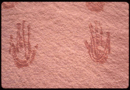 Hand prints on cliff wall