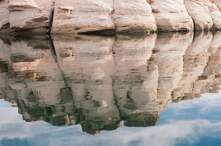 Mineral-stained rock formations in Wahweap Bay