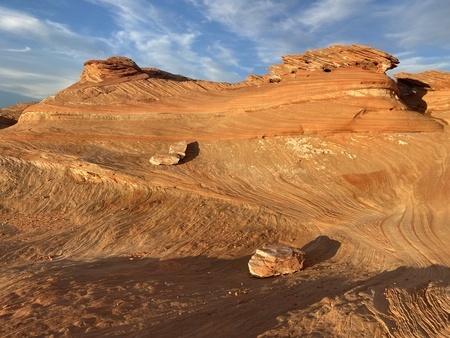 Reexposed rock formations, speckled with mineral deposits from Lake Powell