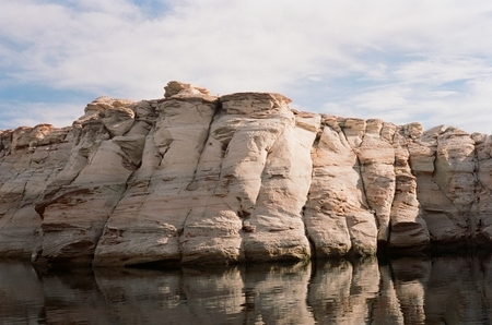 Mineral-stained rock formations in Wahweap Bay