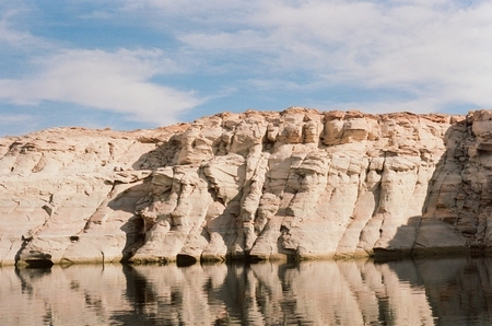 Mineral-stained rock formations in Wahweap Bay