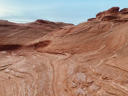 Rock formations, reexposed and spotted with mineral crusts from Lake Powell
