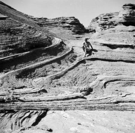 Tad Nichols sitting on rock steps at Crossing of the Fathers