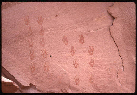 Hand prints on cliff wall